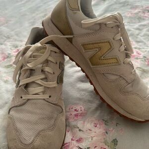 New Balance Off-White Sneakers with Gold Accents